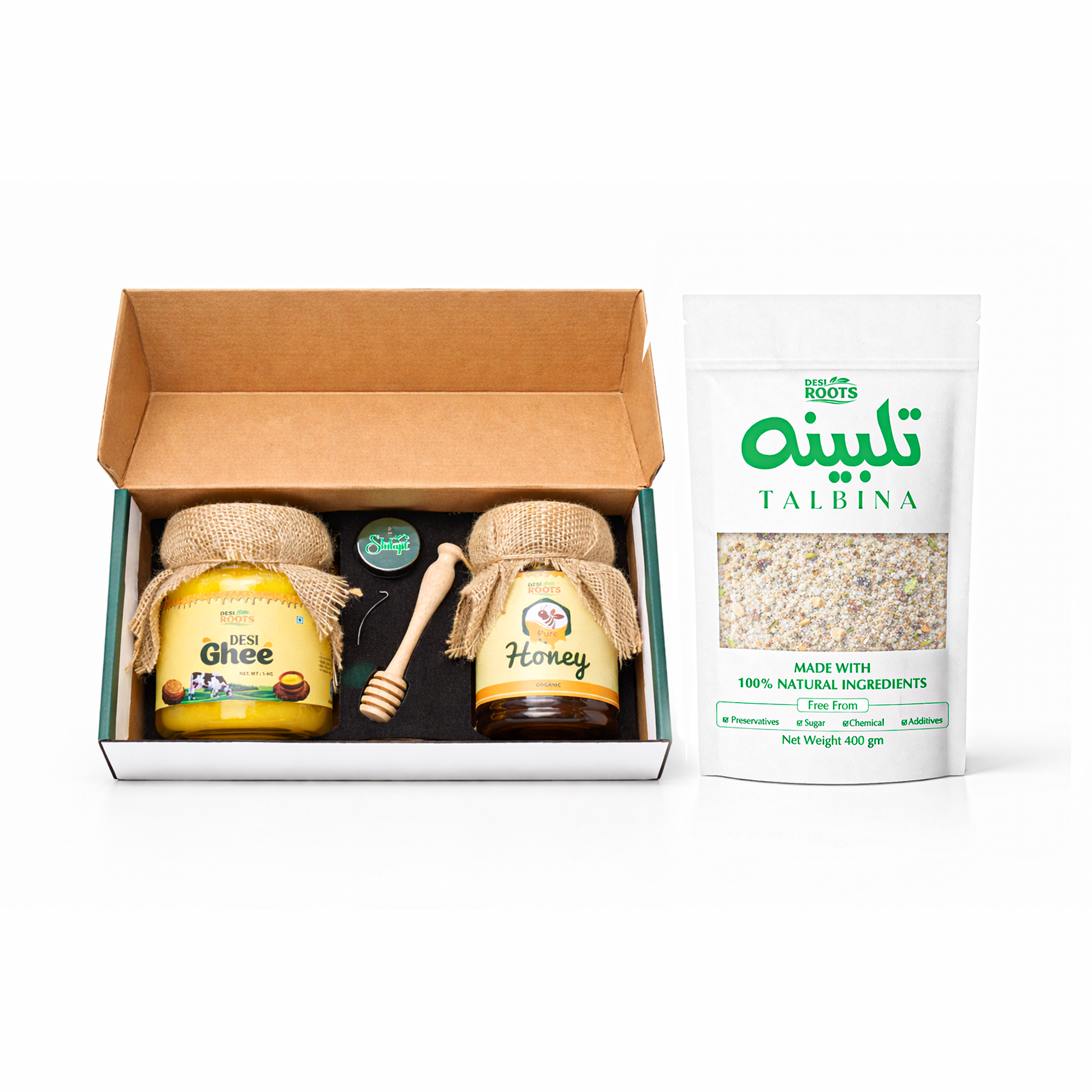Desi Roots Premium Gift Box including jars of pure honey and desi ghee, a pack of 15-ingredient talbina, and a container of Gilgit shilajit."
